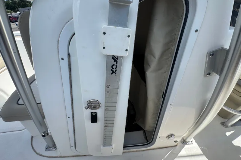 Slide: The Image of Sea Fox 206 Commander 2016 boat storage compartment with measuring scale and lock. - 38