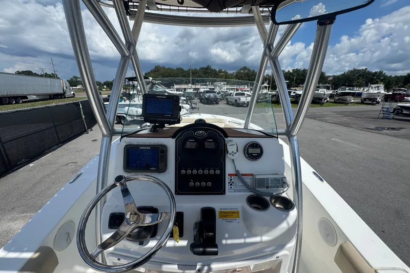 Slide: The Image of 2016 Sea Fox 206 Commander boat dashboard with navigation equipment and steering wheel. - 22