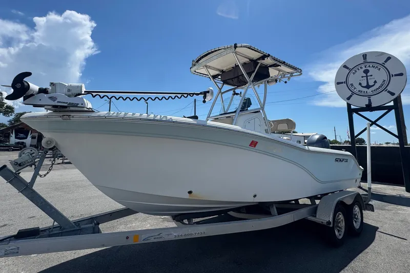 Slide: The Image of A 2016 Sea Fox 206 Commander on a trailer, parked under a sunny sky. - 13