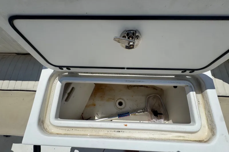 Slide: The Image of Open storage compartment on a 2016 Sea Fox 206 Commander boat, showing interior details. - 46