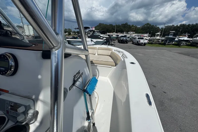 Slide: The Image of 2016 Sea Fox 206 Commander boat with seating, parked outdoors under cloudy skies. - 27