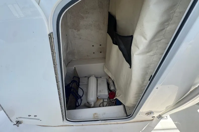 Slide: The Image of Storage compartment of a 2016 Sea Fox 206 Commander boat with equipment inside. - 37