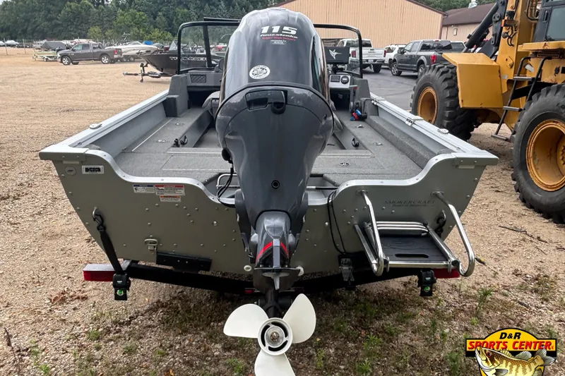 Slide: The Image of 2023 Smoker Craft Excursion 176 DC Pro boat with powerful outboard motor, parked outdoors. - 3