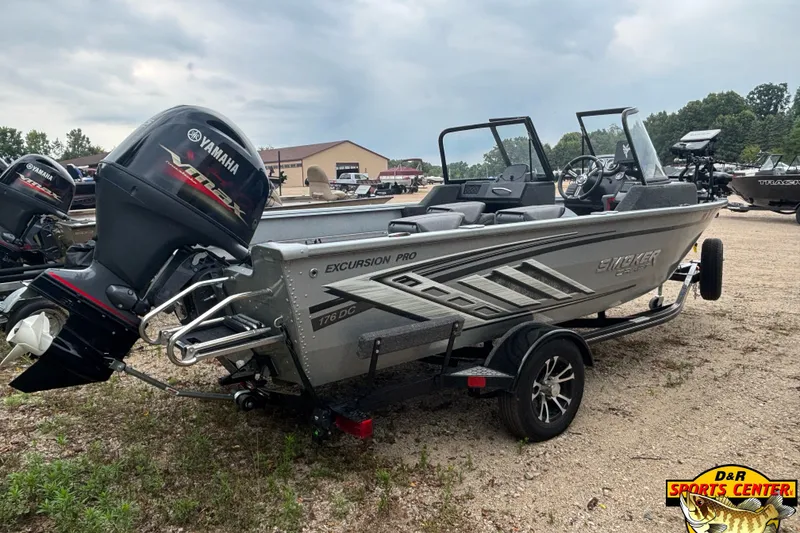Slide: The Image of 2023 Smoker Craft Excursion 176 DC Pro boat with Yamaha engine on trailer. - 4