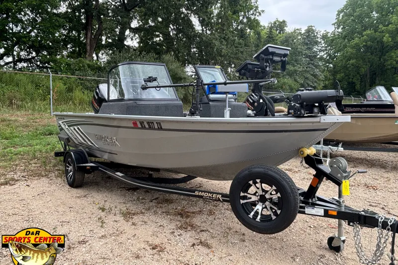 Slide: The Image of 2023 Smoker Craft Excursion 176 DC Pro boat on trailer, parked outdoors. - 5
