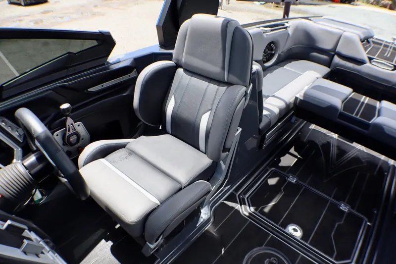 Slide: The Image of 2022 Supra SE 450 boat interior with luxurious seating and modern dashboard design. - 15