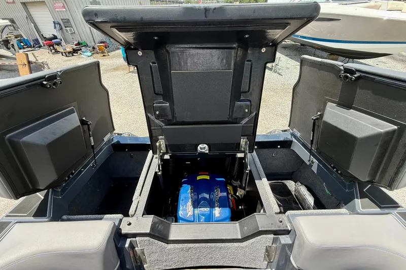 Slide: The Image of 2022 Supra SE 450 boat engine compartment with open hatches, showcasing the engine. - 30