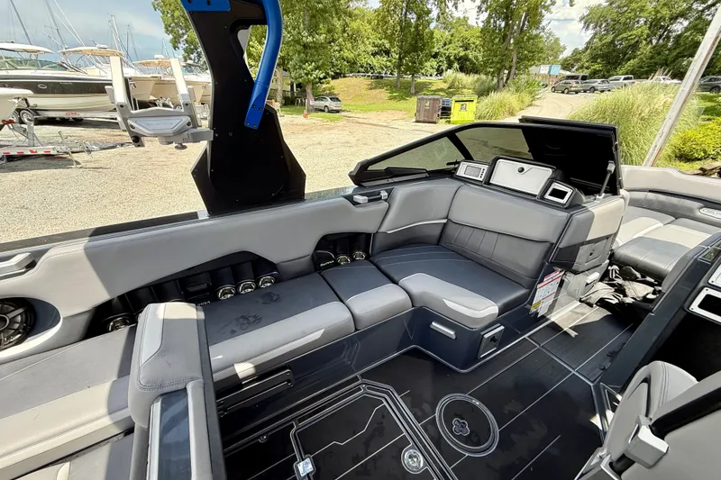 Slide: The Image of Interior of a 2022 Supra SE 450 boat with sleek seating and modern design. - 20