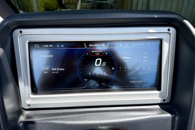 Slide: The Image of Dashboard display of 2022 Supra SE 450 showing radio and navigation settings. - 18