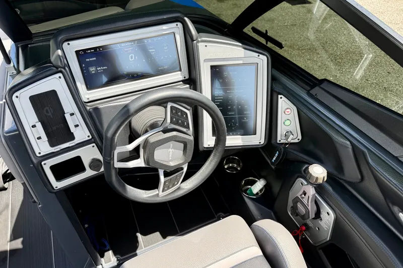Slide: The Image of 2022 Supra SE 450 dashboard with advanced touchscreen controls and steering wheel. - 17