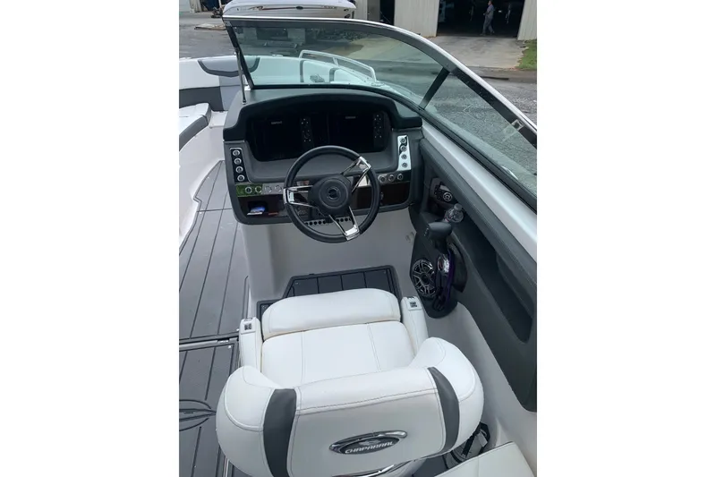 Slide: The Image of 2022 Chaparral 28 Surf boat cockpit with steering wheel and control panel. - 5
