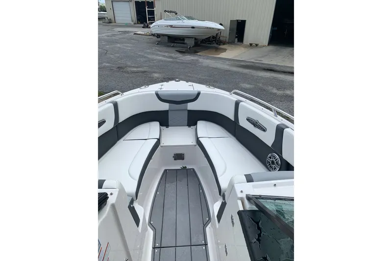 Slide: The Image of 2022 Chaparral 28 Surf boat interior with sleek seating and modern design. - 4