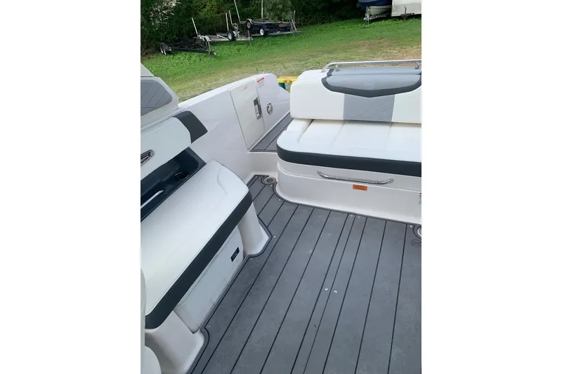 Slide: The Image of 2022 Chaparral 28 Surf boat interior with sleek seating and modern design. - 3