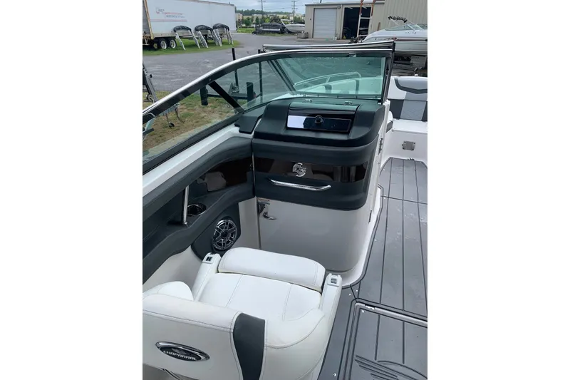 Slide: The Image of 2022 Chaparral 28 Surf boat interior with sleek seating and modern dashboard design. - 6