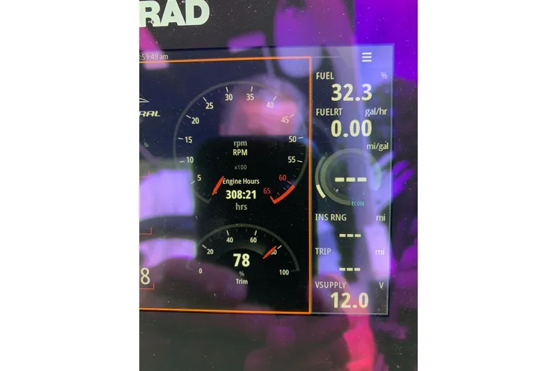 Slide: The Image of Dashboard display of a 2022 Chaparral 28 Surf boat showing engine hours and fuel data. - 9