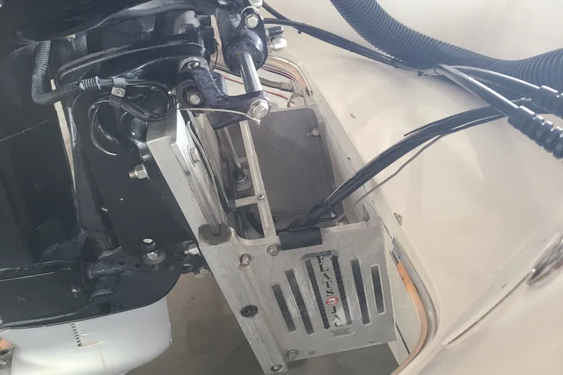 Slide: The Image of Close-up of a 1994 Checkmate Pulsare 2100 boat engine components and hydraulic system. - 25