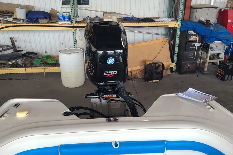 Slide: The Image of 1994 Checkmate Pulsare 2100 boat with Mercury 250 XS engine in a workshop. - 17