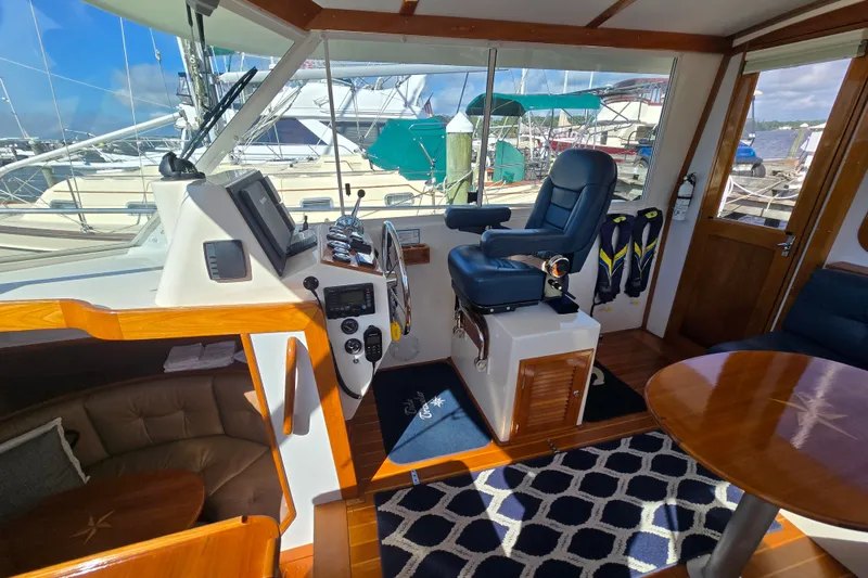 Slide: The Image of Interior of 2006 Bruckmann Bluestar 37 yacht with helm, seating, and nautical decor. - 24