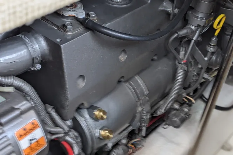 Slide: The Image of Engine compartment of a 2006 Bruckmann Bluestar 37 boat, showcasing mechanical components. - 35