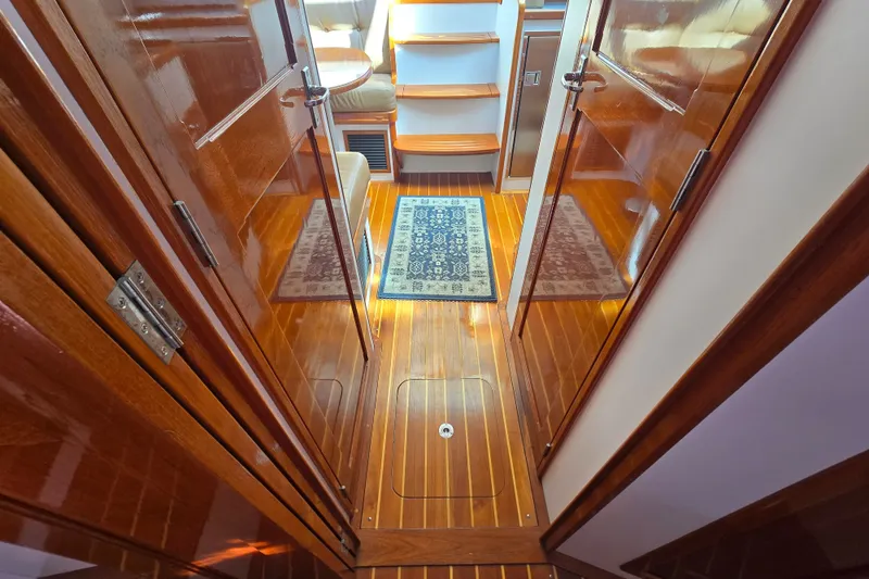 Slide: The Image of Interior of 2006 Bruckmann Bluestar 37 yacht with polished wood and elegant decor. - 49