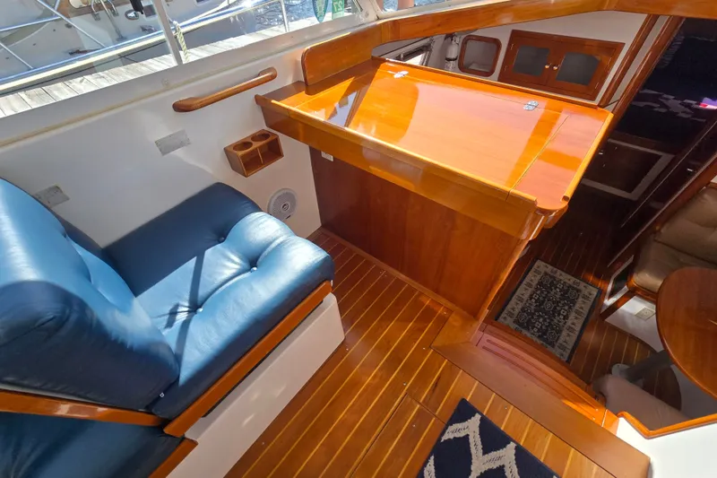 Slide: The Image of Interior of 2006 Bruckmann Bluestar 37 yacht with polished wood and blue seating. - 31