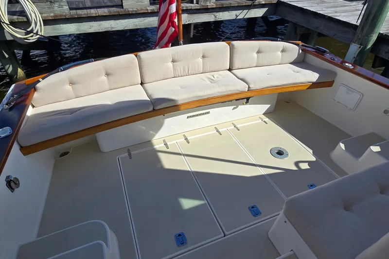 Slide: The Image of Spacious deck of 2006 Bruckmann Bluestar 37 with cushioned seating and American flag. - 17