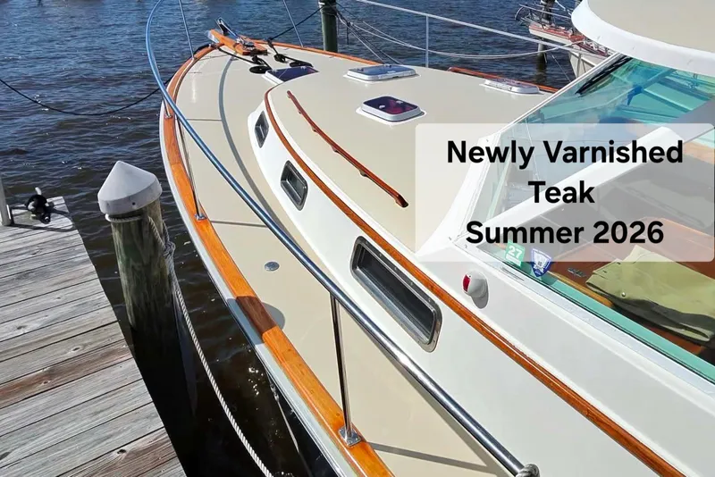 Slide: The Image of Bruckmann Bluestar 37 boat with newly varnished teak, docked, summer 2026. - 15