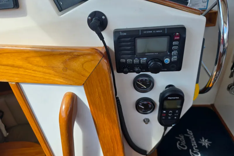 Slide: The Image of Control panel of a 2006 Bruckmann Bluestar 37 boat with radio and gauges. - 25