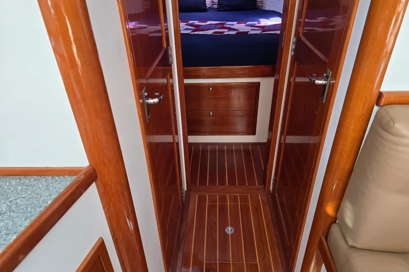 Slide: The Image of Interior of 2006 Bruckmann Bluestar 37 yacht with polished wood finish and cozy cabin. - 45