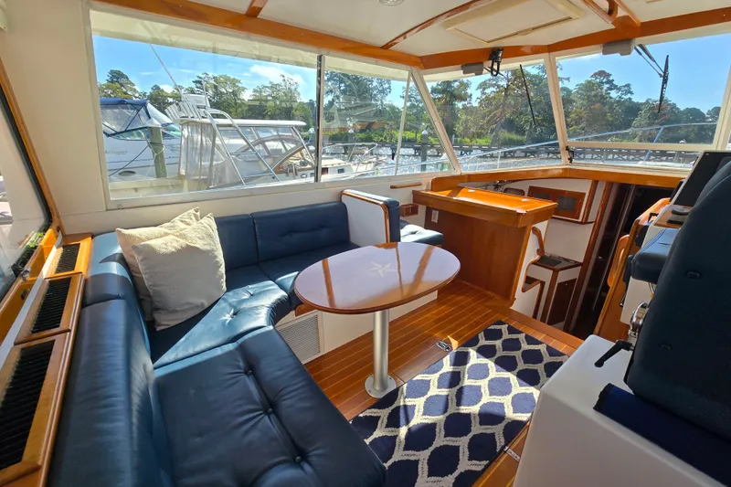 Slide: The Image of Luxurious interior of 2006 Bruckmann Bluestar 37 yacht with plush seating and elegant wood finishes. - 22