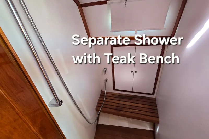 Slide: The Image of Separate shower with teak bench on 2006 Bruckmann Bluestar 37 yacht. - 48