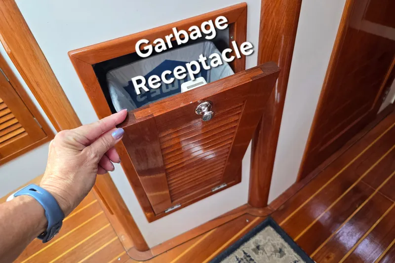 Slide: The Image of Wooden garbage receptacle on 2006 Bruckmann Bluestar 37 boat interior. - 42