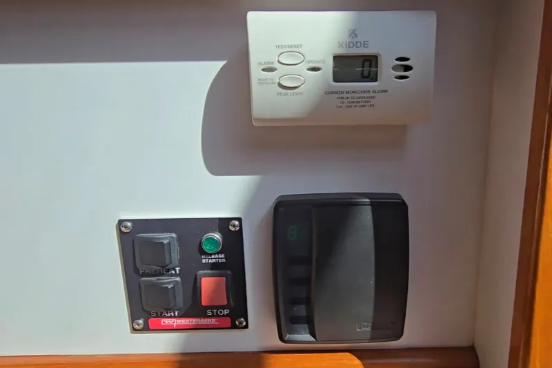 Slide: The Image of Control panel and carbon monoxide alarm on 2006 Bruckmann Bluestar 37 boat. - 51