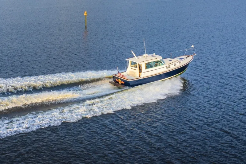 Slide: The Image of 2006 Bruckmann Bluestar 37 cruising on open water, leaving a wake behind. - 54