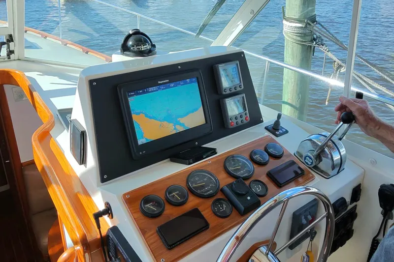 Slide: The Image of Helm of 2006 Bruckmann Bluestar 37 with navigation equipment and controls. - 27