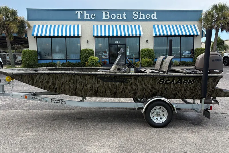 The Image of 2027 SeaArk Shadow 17 boat on trailer outside The Boat Shed dealership. - 1