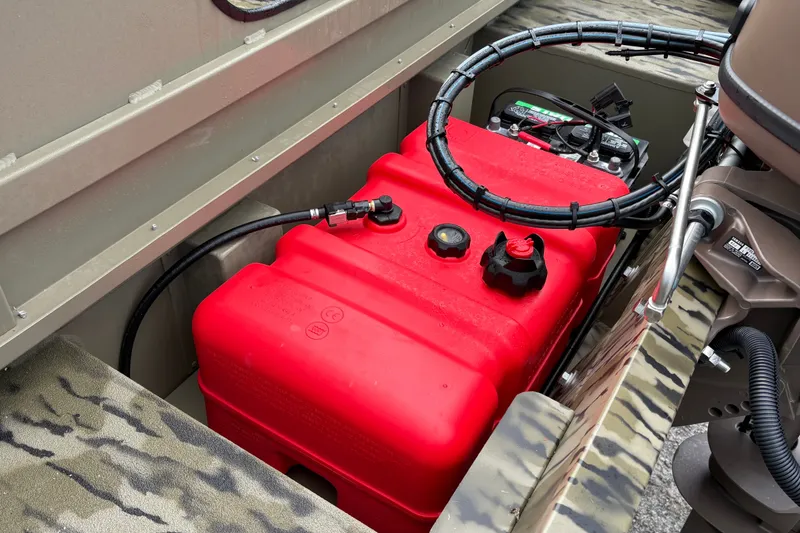 Slide: The Image of Red fuel tank in a 2027 SeaArk Shadow 17 boat, showcasing engine components. - 5