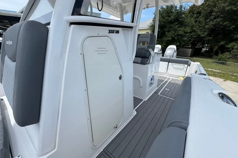 Slide: The Image of 2026 NauticStar 332 Offshore boat interior with seating and storage compartments. - 26