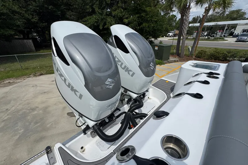 Slide: The Image of Twin Suzuki outboard engines on a 2026 NauticStar 332 Offshore boat. - 49