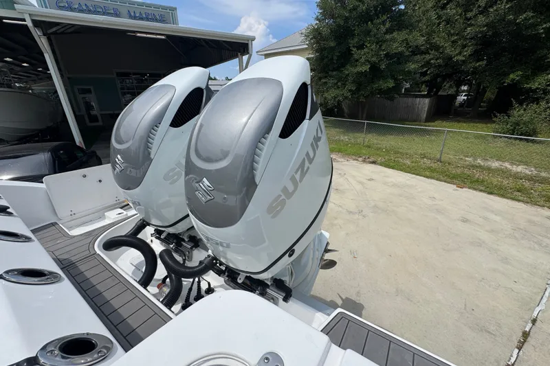 Slide: The Image of 2026 NauticStar 332 Offshore with dual Suzuki outboard engines at Grander Marine. - 48