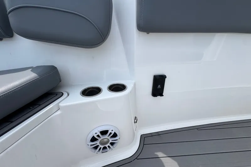 Slide: The Image of Interior of 2026 NauticStar 332 Offshore boat with cup holders and speaker. - 29