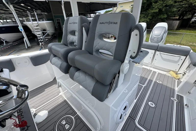 Slide: The Image of 2026 NauticStar 332 Offshore boat with luxurious seating and modern design. - 33