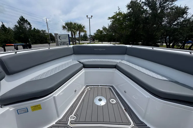 Slide: The Image of 2026 NauticStar 332 Offshore boat interior with gray seating and sleek deck design. - 21