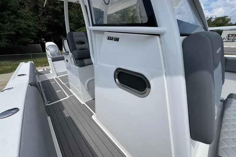 Slide: The Image of 2026 NauticStar 332 Offshore boat interior with sleek seating and modern design. - 27