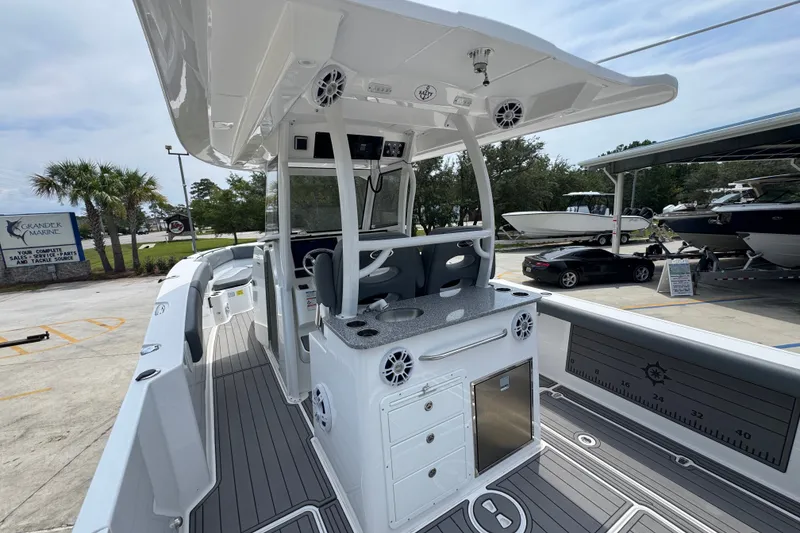 Slide: The Image of 2026 NauticStar 332 Offshore boat interior with modern helm and seating. - 41