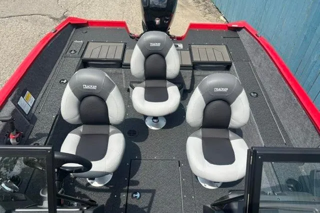 Slide: The Image of 2027 Tracker Pro Guide V-175 Combo boat interior with four cushioned seats and red trim. - 13