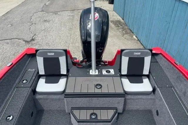Slide: The Image of 2027 Tracker Pro Guide V-175 Combo boat interior with dual seats and motor. - 29