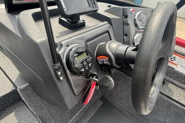 Slide: The Image of 2027 Tracker Pro Guide V-175 Combo dashboard with steering wheel and control panel. - 19