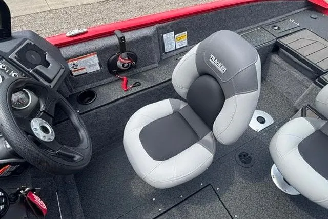 Slide: The Image of 2027 Tracker Pro Guide V-175 Combo boat interior with steering wheel and cushioned seats. - 20