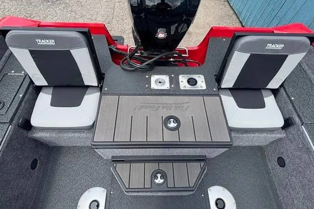 Slide: The Image of 2027 Tracker Pro Guide V-175 Combo boat interior with seating and storage compartments. - 32